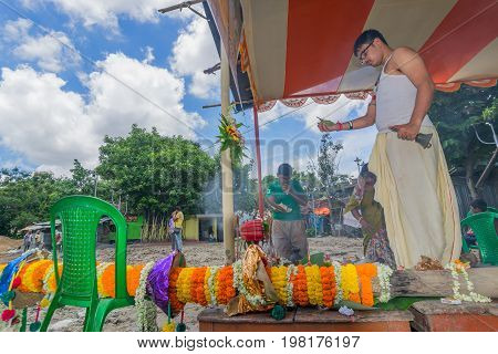 HOWRAH WEST BANGALINDIA - JULY 7TH 2017 : khutipuja the starting ritual of world famous Durga Puja (most famous festival of Hinduism) is being performed by a Hindu Priest amongst Hindu devotees.