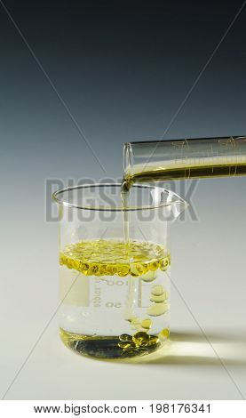 Physics. Immiscible fluids. Oil being poured into water.2 of 4 image series.