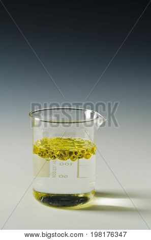 Physics. Immiscible fluids. Oil being poured into water.3 of 4 image series.