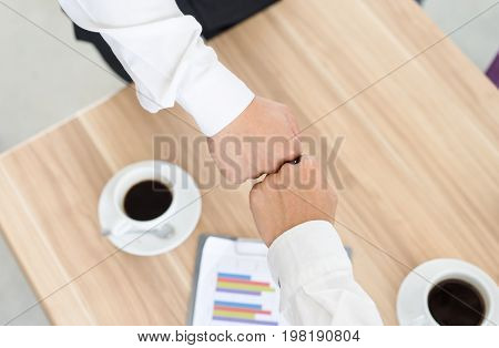 Top View Two Businessman Hitting fists Each Other cooperative and teamwork conceptcorporate life styleCooperation initiative achievement