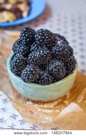 Homemade, sweet, delicious blackberries in a handmade dish