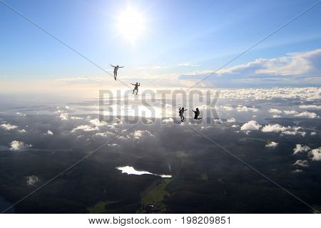 Skydiving over beautiful Norway. Clouds, sun and sky