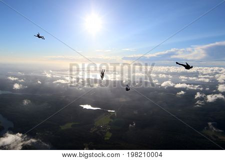 Skydiving over beautiful Norway. Clouds, sun and sky