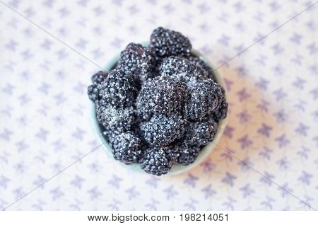 Homemade, sweet, delicious blackberries in a handmade dish