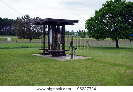 TUSTIN, MICHIGAN / UNITED STATES - MAY 31, 2017: The Tustin Rest Area and Scenic Overlook, on U.S. Highway 131, offers a pump where motorist may obtain potable well water.