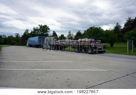 TUSTIN, MICHIGAN / UNITED STATES - MAY 31, 2017: Trucks are parked in the Tustin Rest Area and Scenic Overlook, on Highway 131.