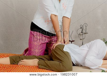 Traditional Thai Massage, Woman Getting Thai Deep Massage In Spa