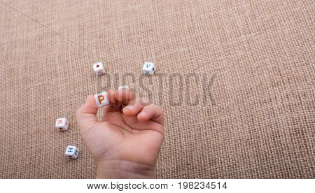 Colorful Alphabet Letter Cubes In Hand