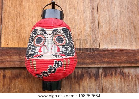Japanese Lantern on the wood wall .