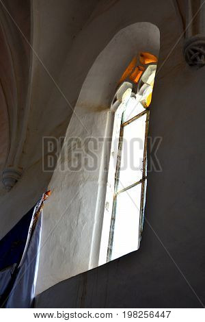 Window inside the fortified medieval church in Dirjiu, Transylvania