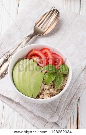 Warm Quinoa Salad With Vegetables - Avocado, Red Onion, Tomatoes, Bell Pepper, Basil And Olive Oil.