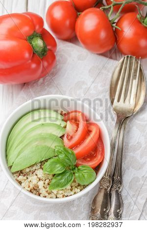 Warm Quinoa Salad With Vegetables - Avocado, Red Onion, Tomatoes, Bell Pepper, Basil And Olive Oil.
