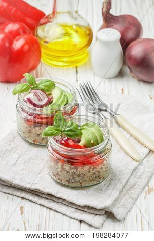 Warm Quinoa Salad With Vegetables - Avocado, Red Onion, Tomatoes, Bell Pepper, Basil And Olive Oil.