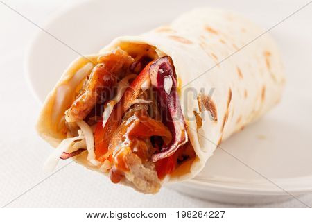 tortilla fajita wraps with meat and vegetables
