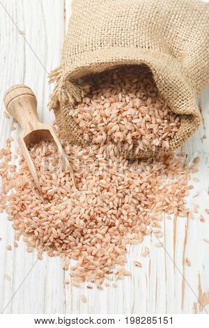 Raw Organic Devzira Rice On A White Table