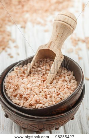 Raw Organic Devzira Rice On A White Table Closeup