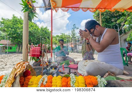 HOWRAH WEST BANGALINDIA - JULY 7TH 2017 : khutipuja the starting ritual of world famous Durga Puja (most famous festival of Hinduism) is being performed by a Hindu Priest amongst Hindu devotees.