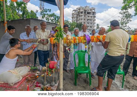 HOWRAH WEST BANGALINDIA - JULY 7TH 2017 : khutipuja the starting ritual of world famous Durga Puja (most famous festival of Hinduism) is being performed by a Hindu Priest amongst Hindu devotees.