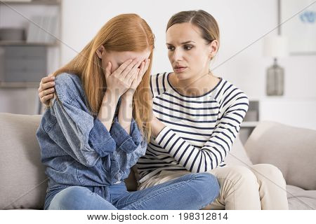 Depressed Woman Comforted By Friend
