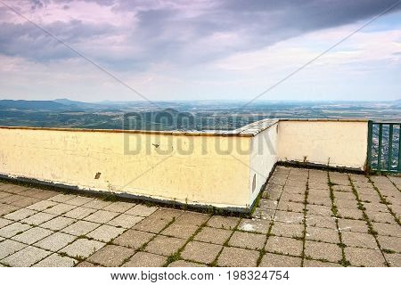 Lookout With Wall And Railing On Top Of Lovos Hill With View Radobyl Hill