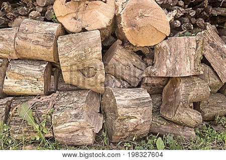 Close up of chopped firewood. Firewood stacked and prepared for winter Pile of wood logs