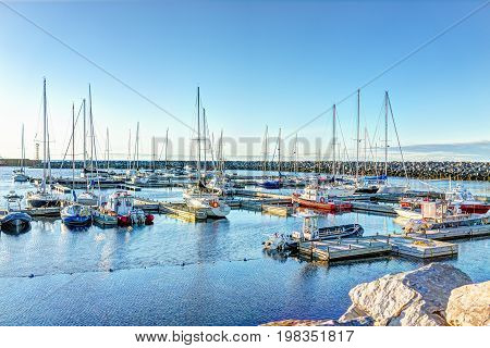 Rimouski Canada - June 4 2017: Harbor Marina with boats during sunset in Quebec by Saint Lawrence river water