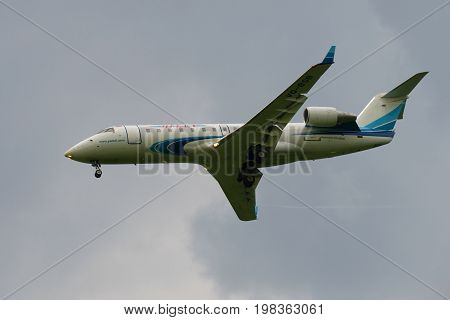 SAINT PETERSBURG, RUSSIA - JULY 03, 2016: Passenger plane Bombardier CRJ-200ER (VQ-BSB) Yamal Airlines in a cloudy sky closeup