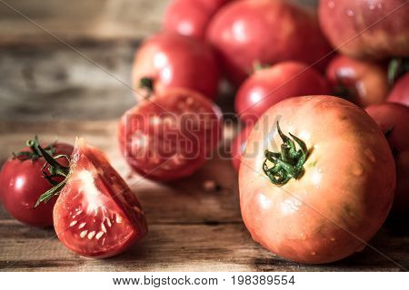 Ripe Tomatoes On Wooden Background Close-up