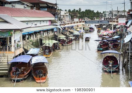 SAMUT SONGKHRAM, THAILAND - JULY 22, 2017 : AMPHAWA FLOATING MARKET is one of the most exciting and colorful places to visit in Thailand today.