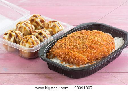 fried pork topped on rice (tonkatsu) and Tako Yaki on Box Japanese food
