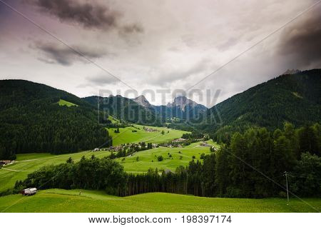 Dolomite landscapes in the summer green of Trentino