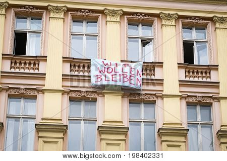 Protest Slogan On Building Facadein Berlin Saying 