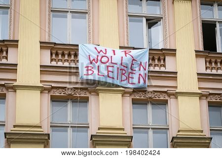 Protest Slogan On Building Facadein Berlin Saying 