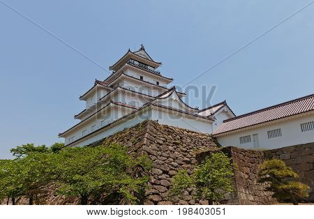 AIZUWAKAMATSU JAPAN - MAY 30 2017: Reconstructed Main Keep of Aizu-Wakamatsu Castle (Tsuruga-jo) Japan. Castle was founded in 1384 by Ashina Naomori demolished in 1874 and reconstructed in 1965