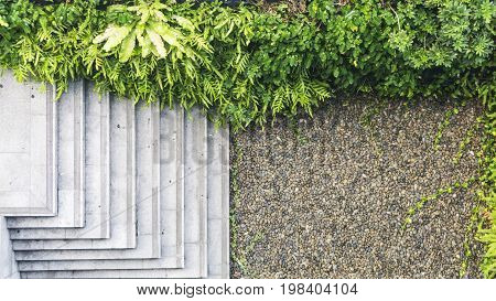 top view of landscape of concrete stair building and the green space of trees and shrubs