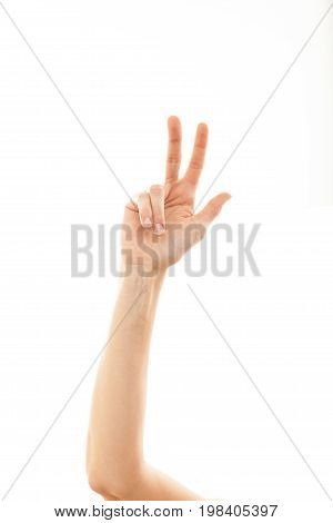 Count Three With The Fingers Of A Woman On A White Background