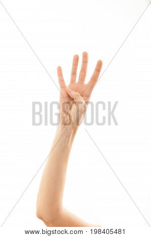 Count Four With The Fingers Of A Woman On A White Background