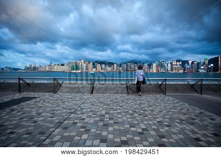 HONG KONG â JULY 18, 2017: Victoria Harbor view with Hong Kong skyline and urban skyscrapers