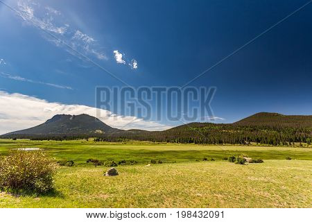 Trail Ridge Road is the name for a stretch of U.S. Highway 34 that traverses Rocky Mountain National Park from Estes Park Colorado in the east to Grand Lake Colorado in the west offering stunning mountain views.