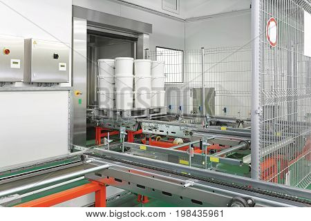 Plastic Barrels at Automated Storage and Retrieval System in Warehouse