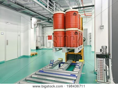 Plastic Barrels at Automated Storage and Retrieval System in Warehouse
