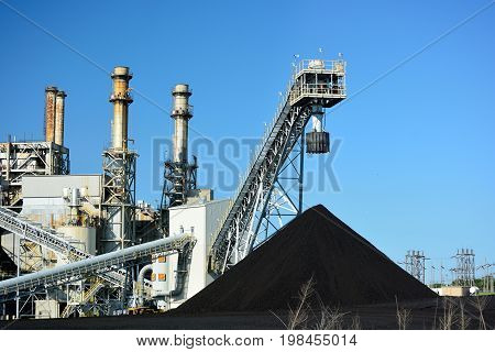 Coal Power Plant and a Large Pile of Coal