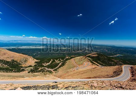 Pikes Peak is the highest summit of the southern Front Range of the Rocky Mountains. The ultra-prominent fourteener is located in Pike National Forest 12 miles west of downtown Colorado Springs. The mountain is named in honor of American explorer Zebulon