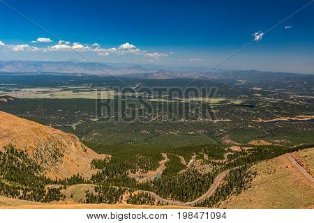 Pikes Peak is the highest summit of the southern Front Range of the Rocky Mountains. The ultra-prominent fourteener is located in Pike National Forest 12 miles west of downtown Colorado Springs. The mountain is named in honor of American explorer Zebulon