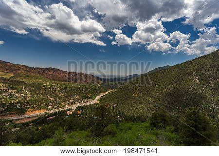 Pikes Peak is the highest summit of the southern Front Range of the Rocky Mountains. The ultra-prominent fourteener is located in Pike National Forest 12 miles west of downtown Colorado Springs. The mountain is named in honor of American explorer Zebulon