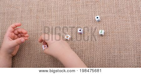 Colorful Alphabet Letter Cubes In Hand