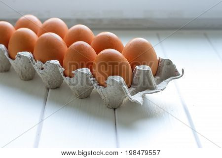 Eggs in the paper tray package on white background.