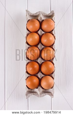 Eggs in the paper tray package on white background.
