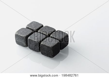 Set of six spirit chilling stones. Soapstone rocks are carved in cubes to be used as drink chiller (whisky bourbon ...) Various type of raw minerals produces different colors such as charcoal black.