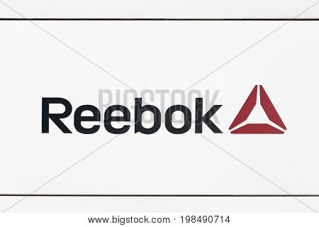 Hamburg, Germany - July 2., 2017: Reebok logo on a wall. Reebok is a global athletic footwear and apparel company, operating as a subsidiary of Adidas since 2005